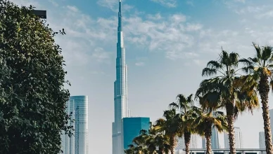 Burj Khalifa towering over green trees