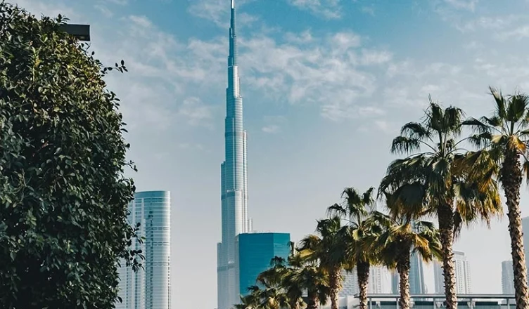 Burj Khalifa towering over green trees