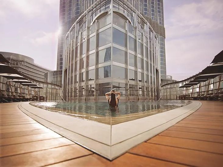 Luxuriate by Armani Hotel Dubai’s pristine pool, framed by chic loungers and sleek minimalist design.